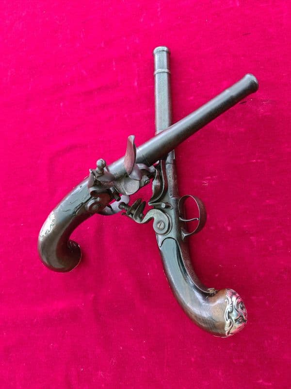 A fine pair of  Queen Anne cannon barrelled silver mounted flintlock pistols. Circa 1760. Ref 3732.